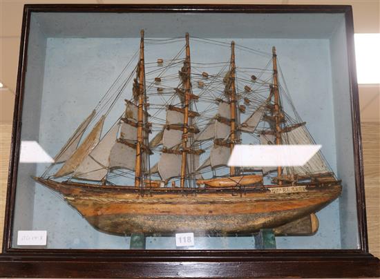 A model ship in a glazed display case height 51 cm width 66cm